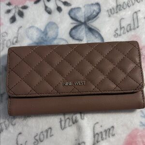 Nine West Zuri Slg Check Sec wallet in a light pink/taupe color preowned